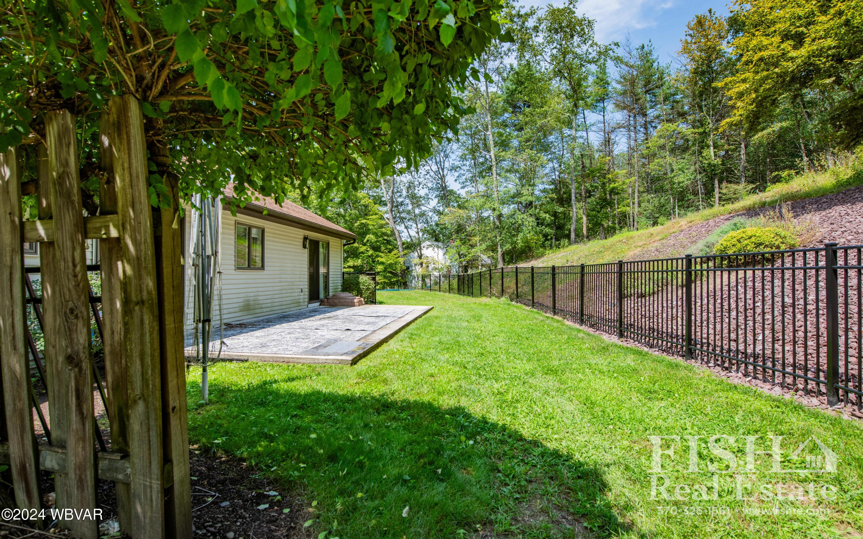 1705 Thomas Road Williamsport, PA 17701 - Photo 4 of 18 Great patio and fenced-in yard. Lot extends up with wooded area.