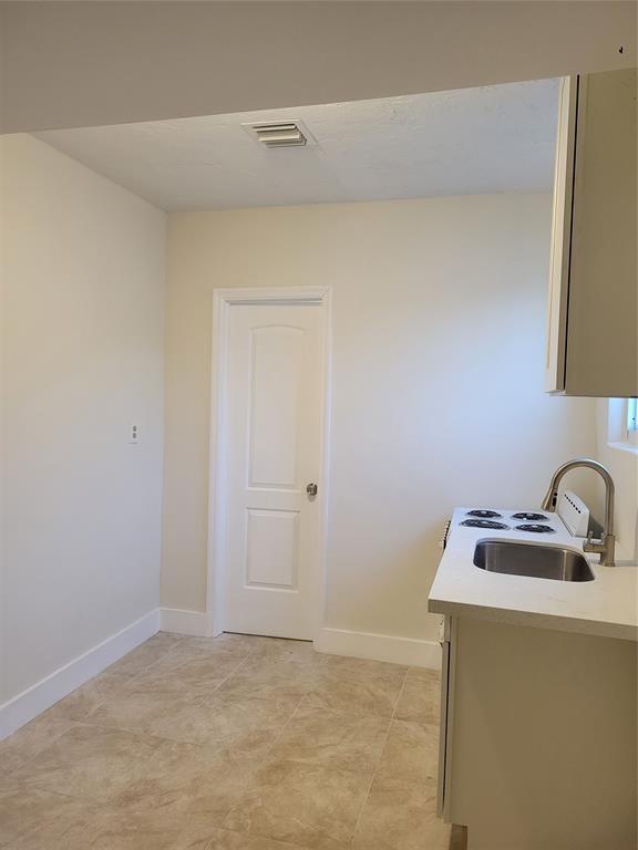 3036 Canal Road Miramar, FL 33025 - Photo 3 of 5 a room with a sink and cabinets