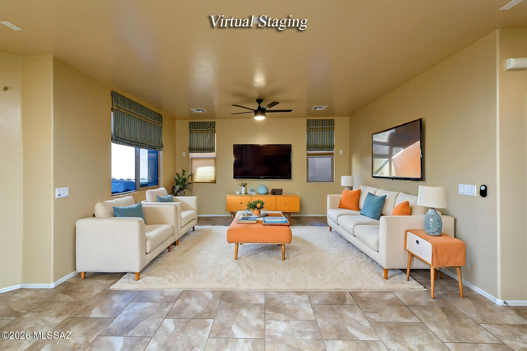 13991 East Cheavront Loop Vail, AZ 85641 - Photo 10 of 47 a living room with furniture and a flat screen tv
