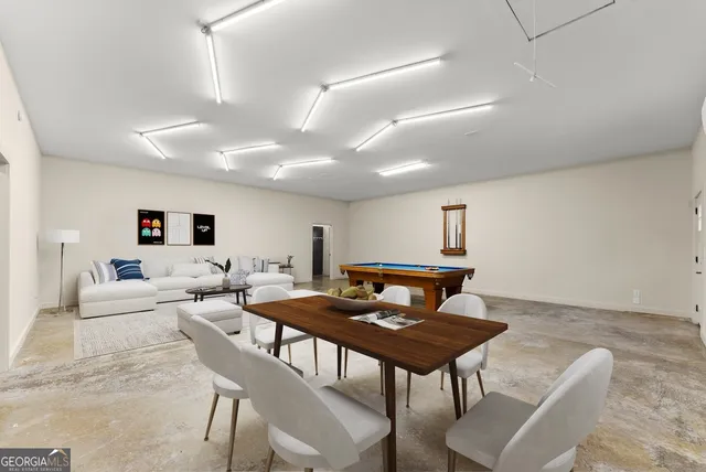 a living room with furniture a rug and a window