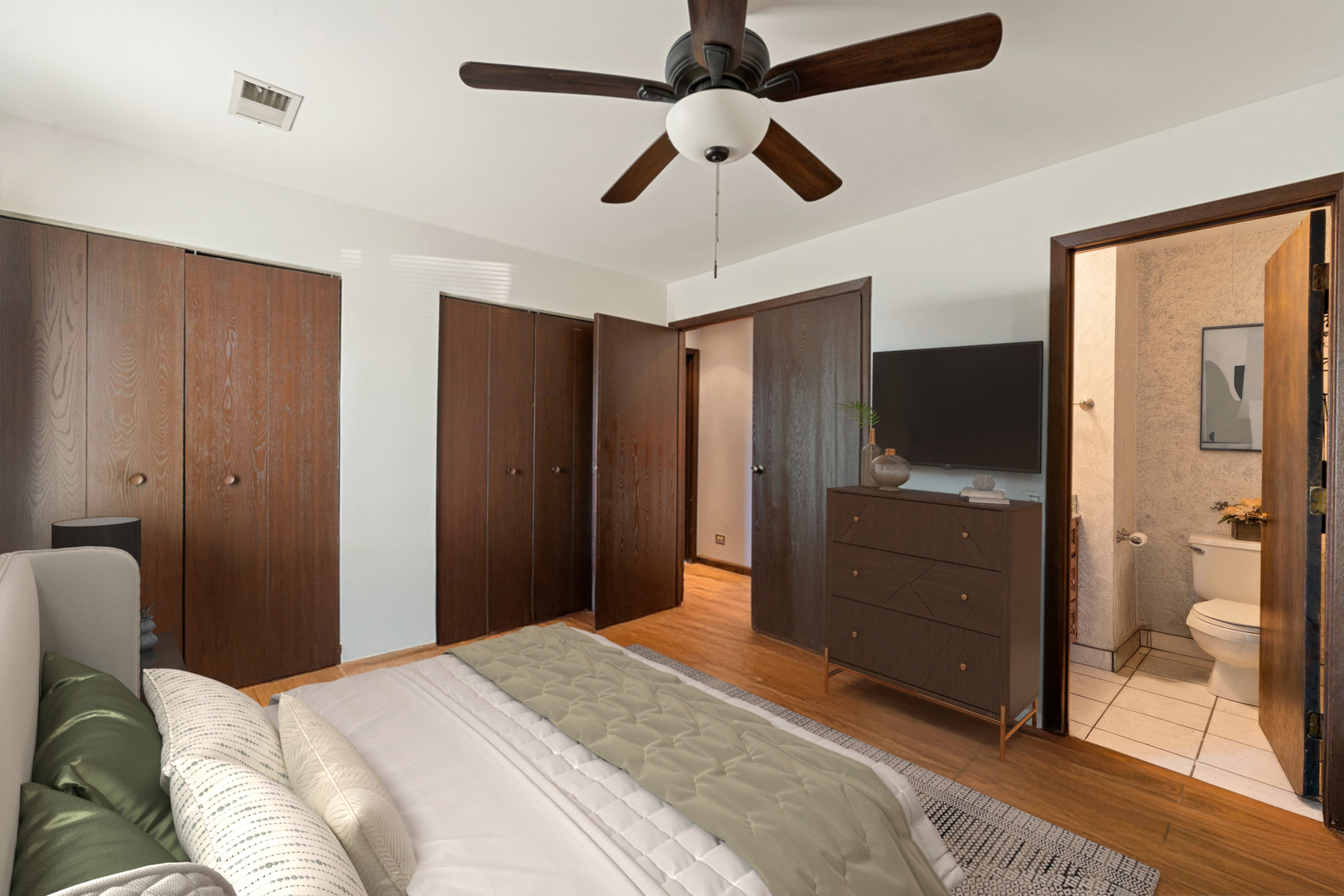 756 Rodenburg Road, Unit 1C Roselle, IL 60172 - Photo 18 of 28 a bedroom with a bed closet and a large mirror