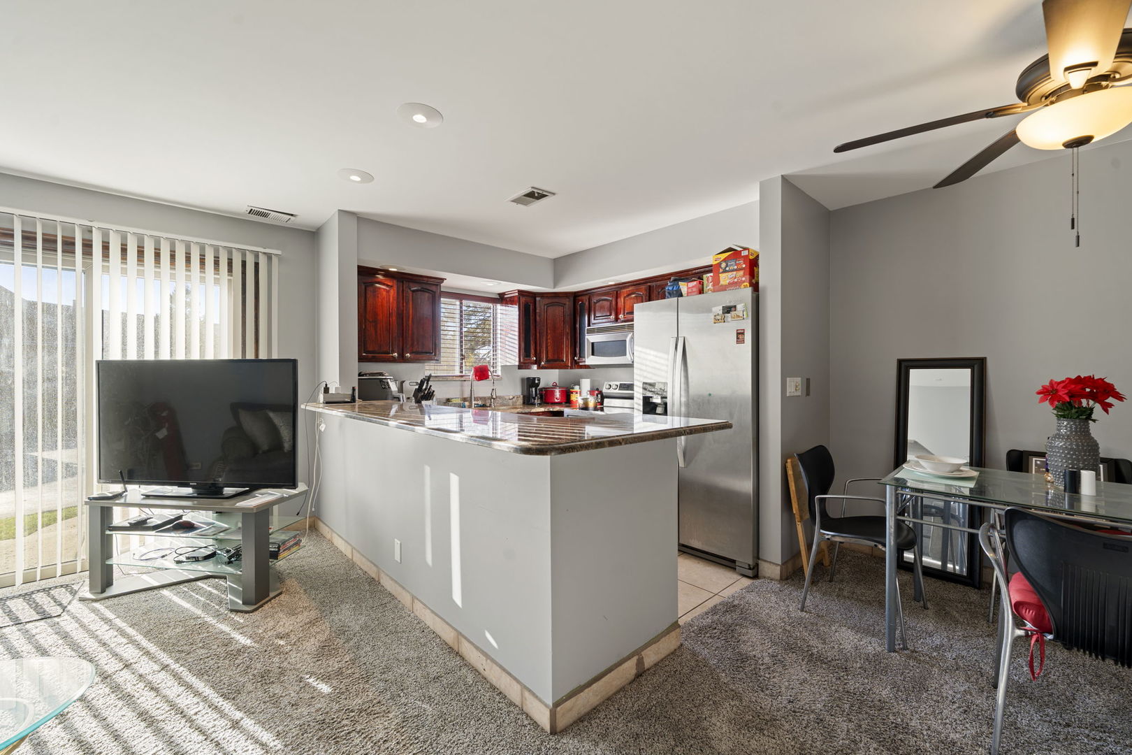 756 Rodenburg Road, Unit 1C Roselle, IL 60172 - Photo 2 of 28 a room with furniture a flat screen tv and a view of living room