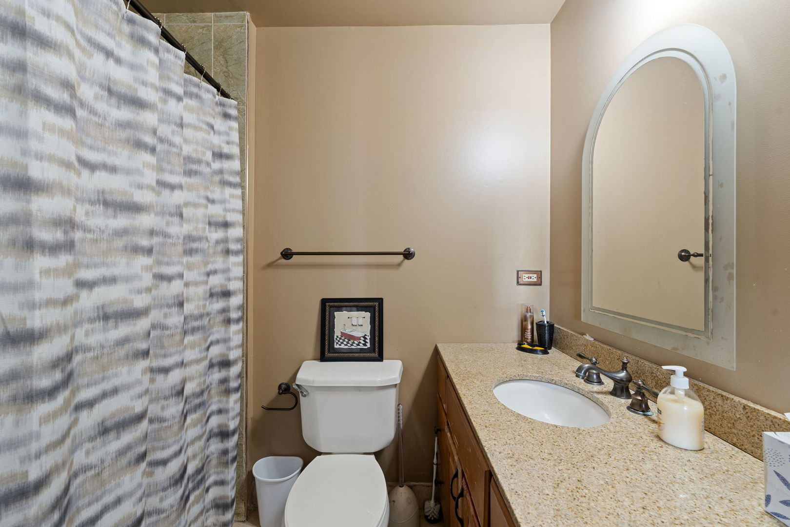 756 Rodenburg Road, Unit 1C Roselle, IL 60172 - Photo 10 of 28 a bathroom with a granite countertop toilet and a sink
