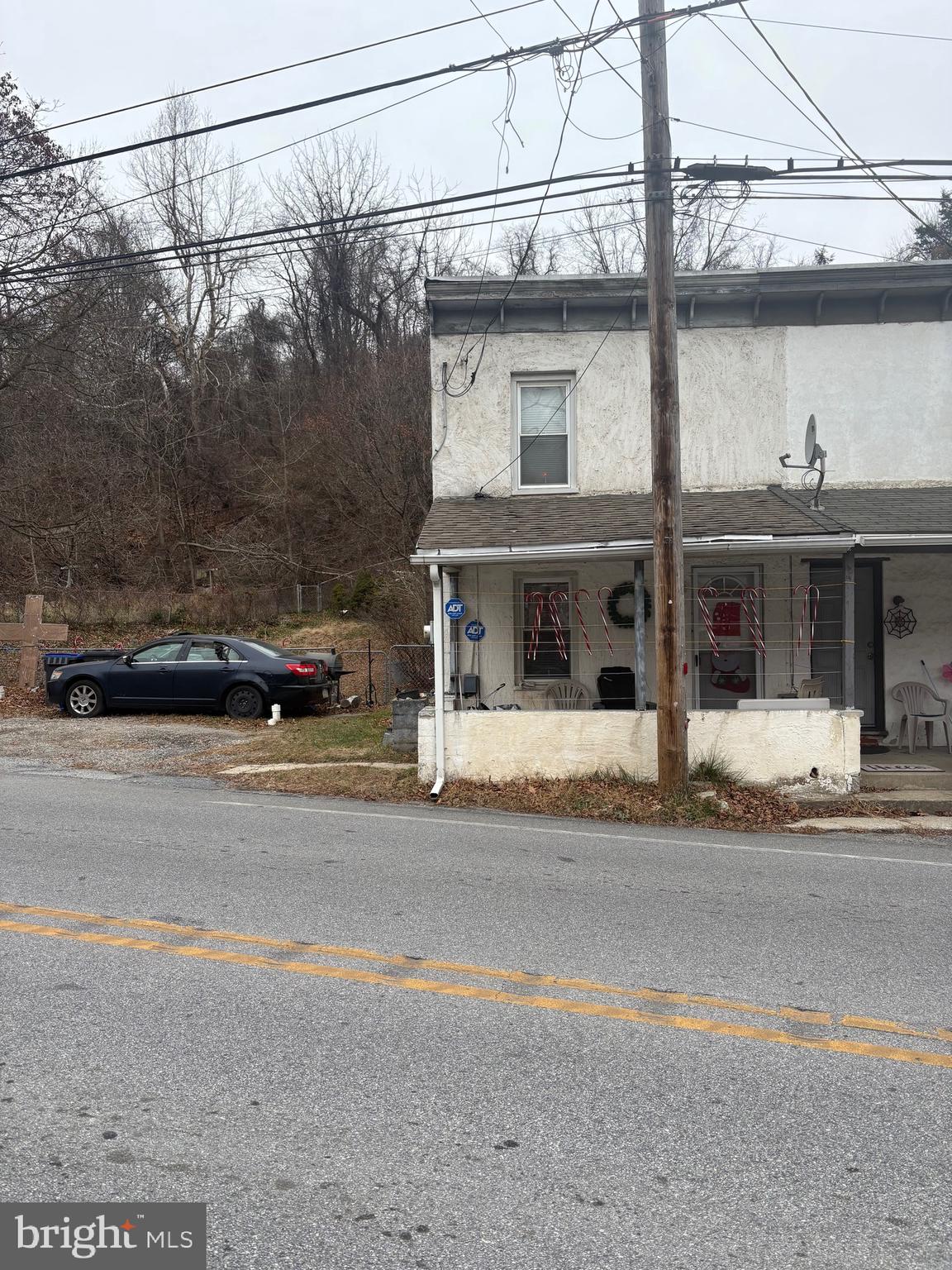 a view of a car parked on the side of the road