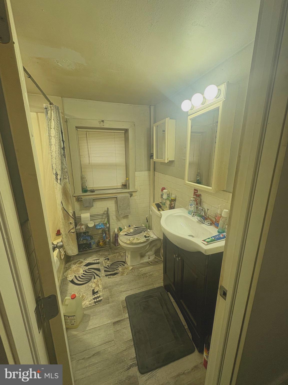 120 Doe Run Road Coatesville, PA 19320 - Photo 12 of 24 a bathroom with a sink and mirror with toilet