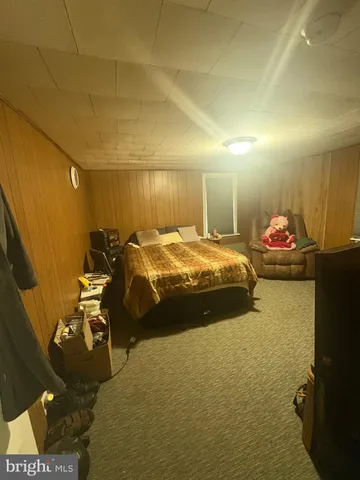 a bedroom with a bed and a table