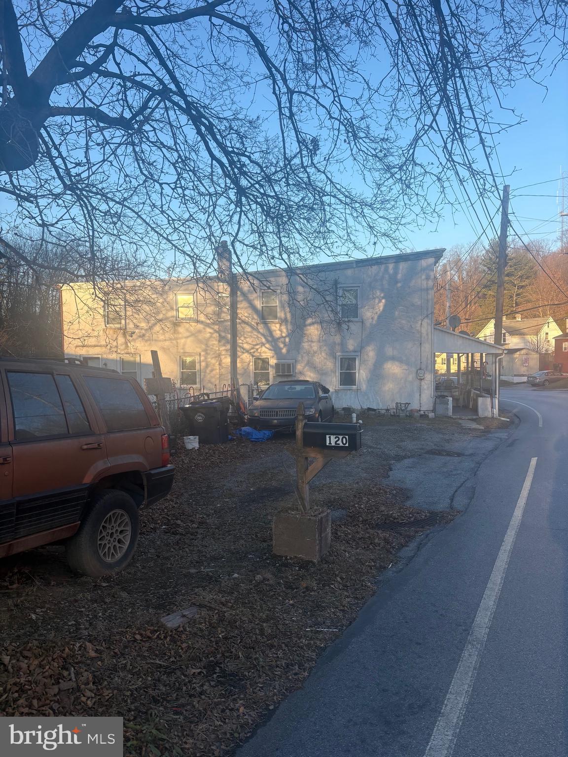 120 Doe Run Road Coatesville, PA 19320 - Photo 21 of 24 a view of a backyard with fire pit and furniture