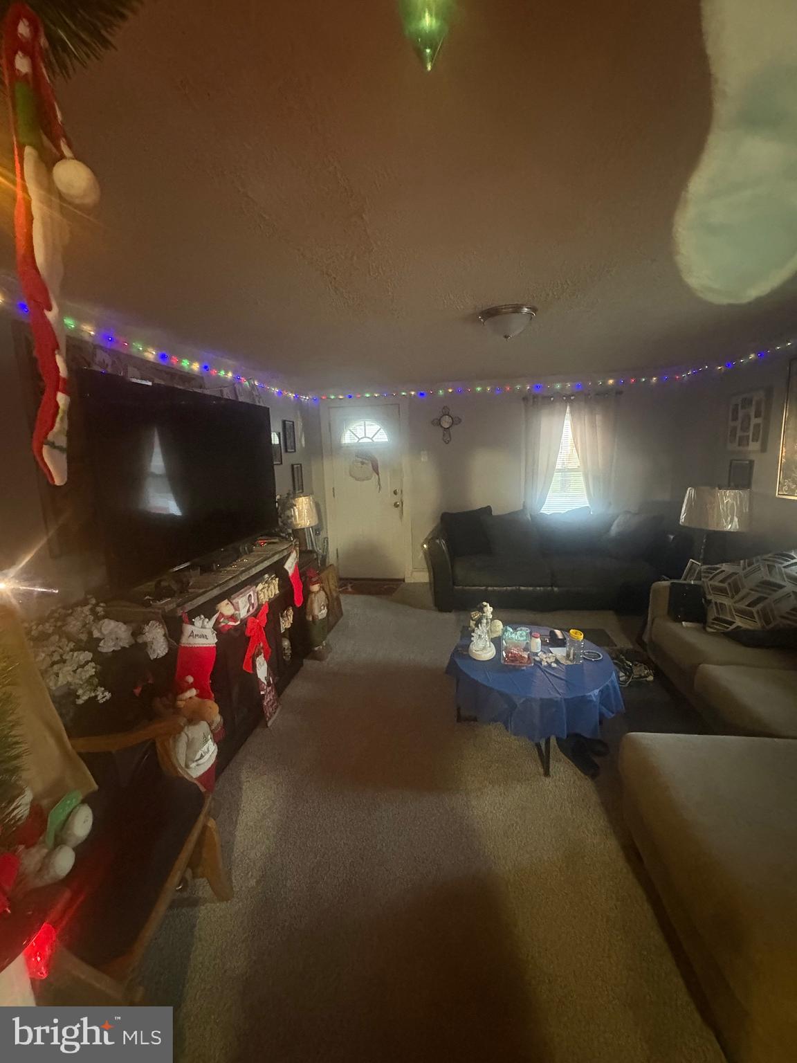 120 Doe Run Road Coatesville, PA 19320 - Photo 24 of 24 a living room with furniture and a flat screen tv