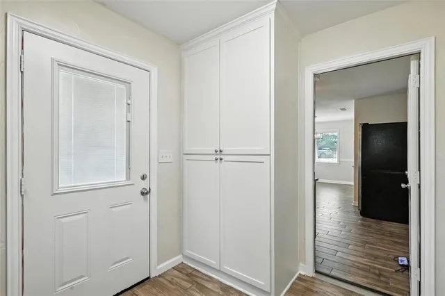 a view of cabinets and wooden floor