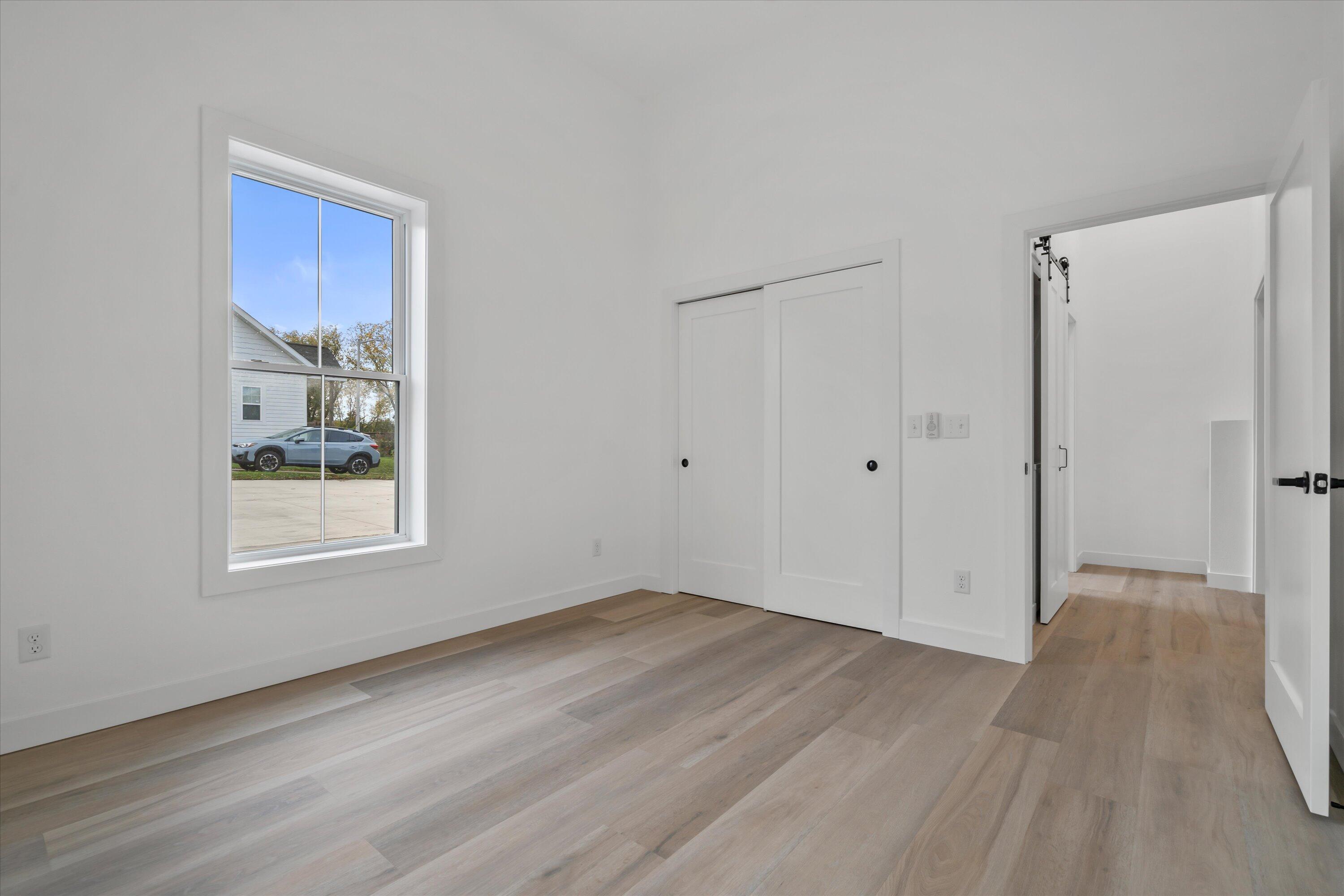 308 Oak Street, Unit 101 Slinger, WI 53086 - Photo 8 of 18 Primary Bedroom