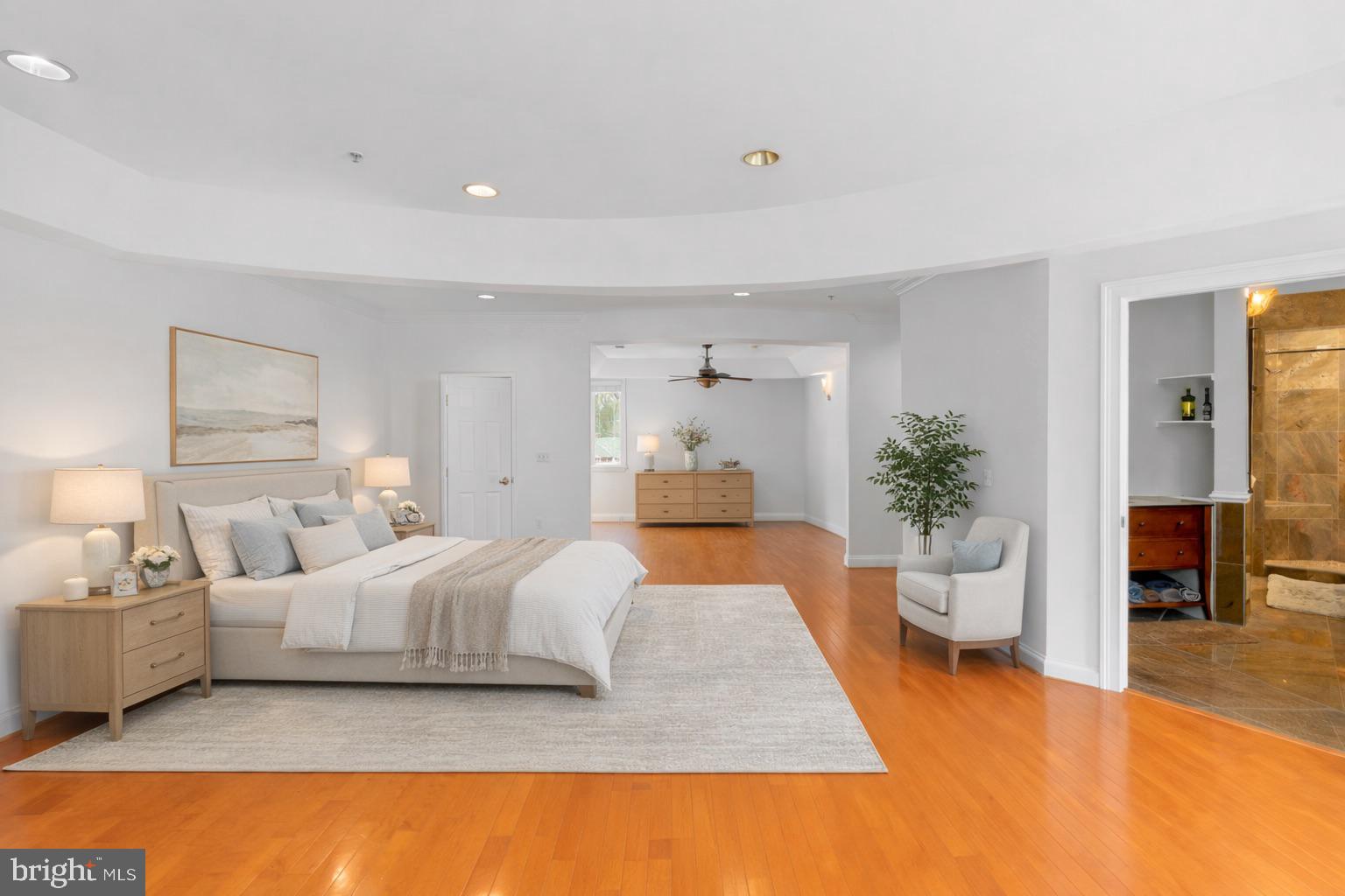 712 Swan Creek Road Fort Washington, MD 20744 - Photo 28 of 73 a bedroom with a large bed and potted plant