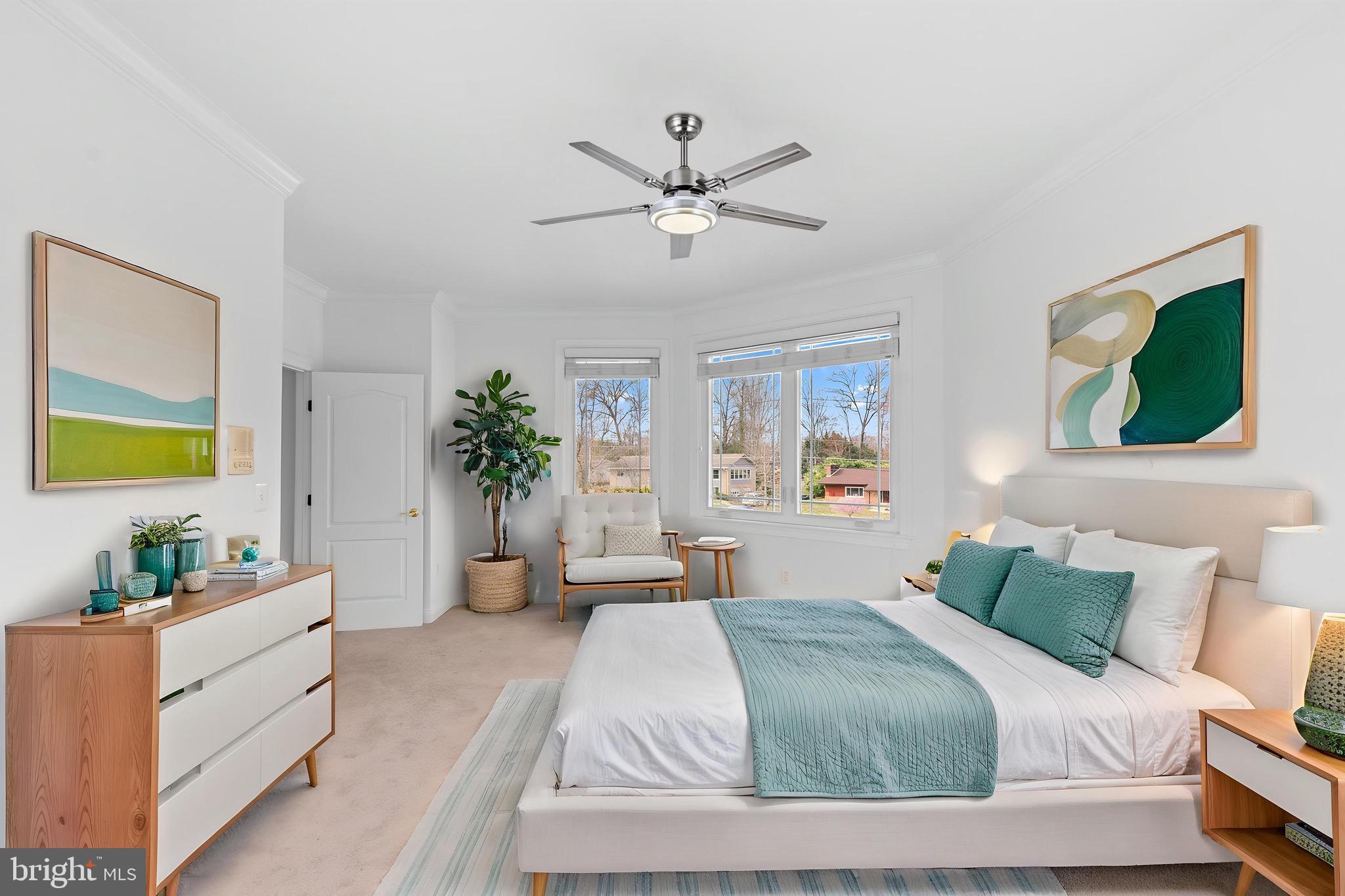 712 Swan Creek Road Fort Washington, MD 20744 - Photo 32 of 73 a bedroom with a large bed and a chandelier