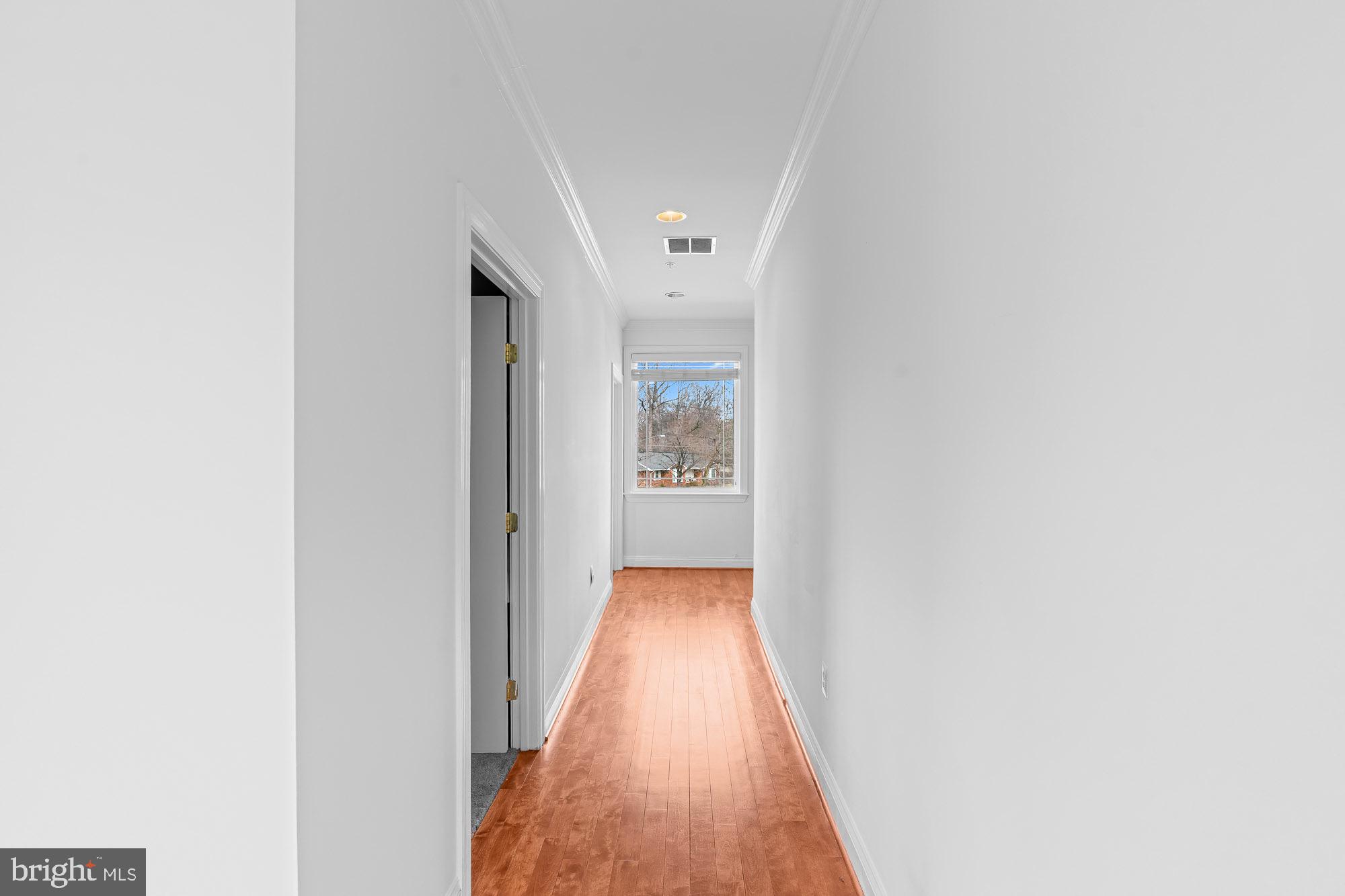 712 Swan Creek Road Fort Washington, MD 20744 - Photo 41 of 73 a view of a hallway with wooden floor