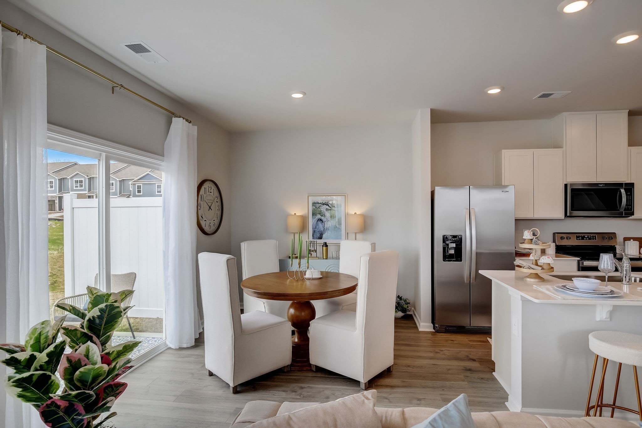 2105 Widgeon Point Lebanon, TN 37090 - Photo 8 of 42 a kitchen with stainless steel appliances a refrigerator a stove a sink a dining table and chairs