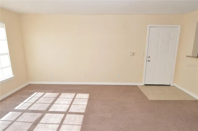 a bathroom with a granite countertop toilet and sink