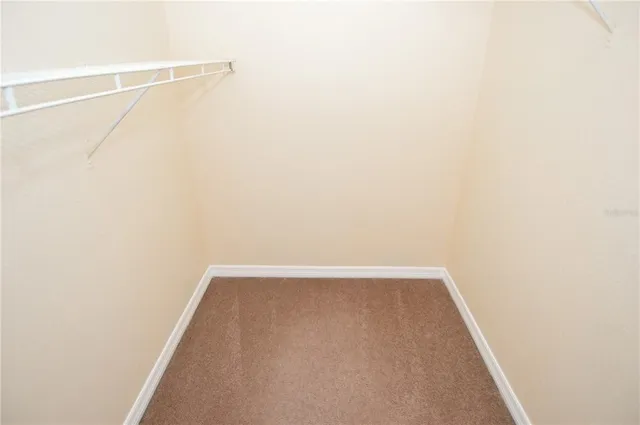 a view of a house with a yard and garden