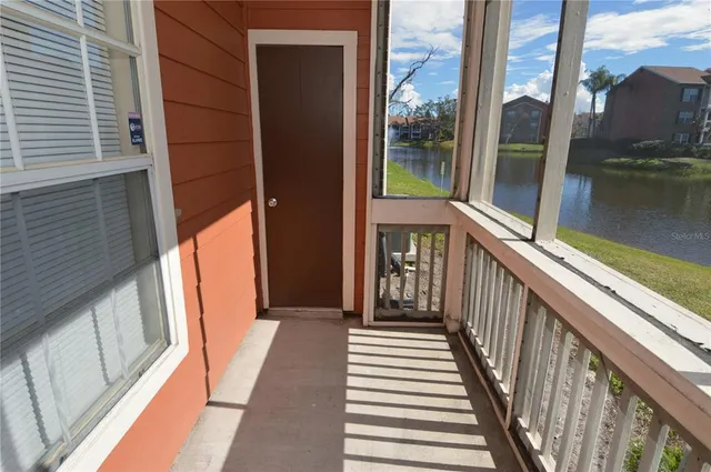 a view of a livingroom with furniture and a window