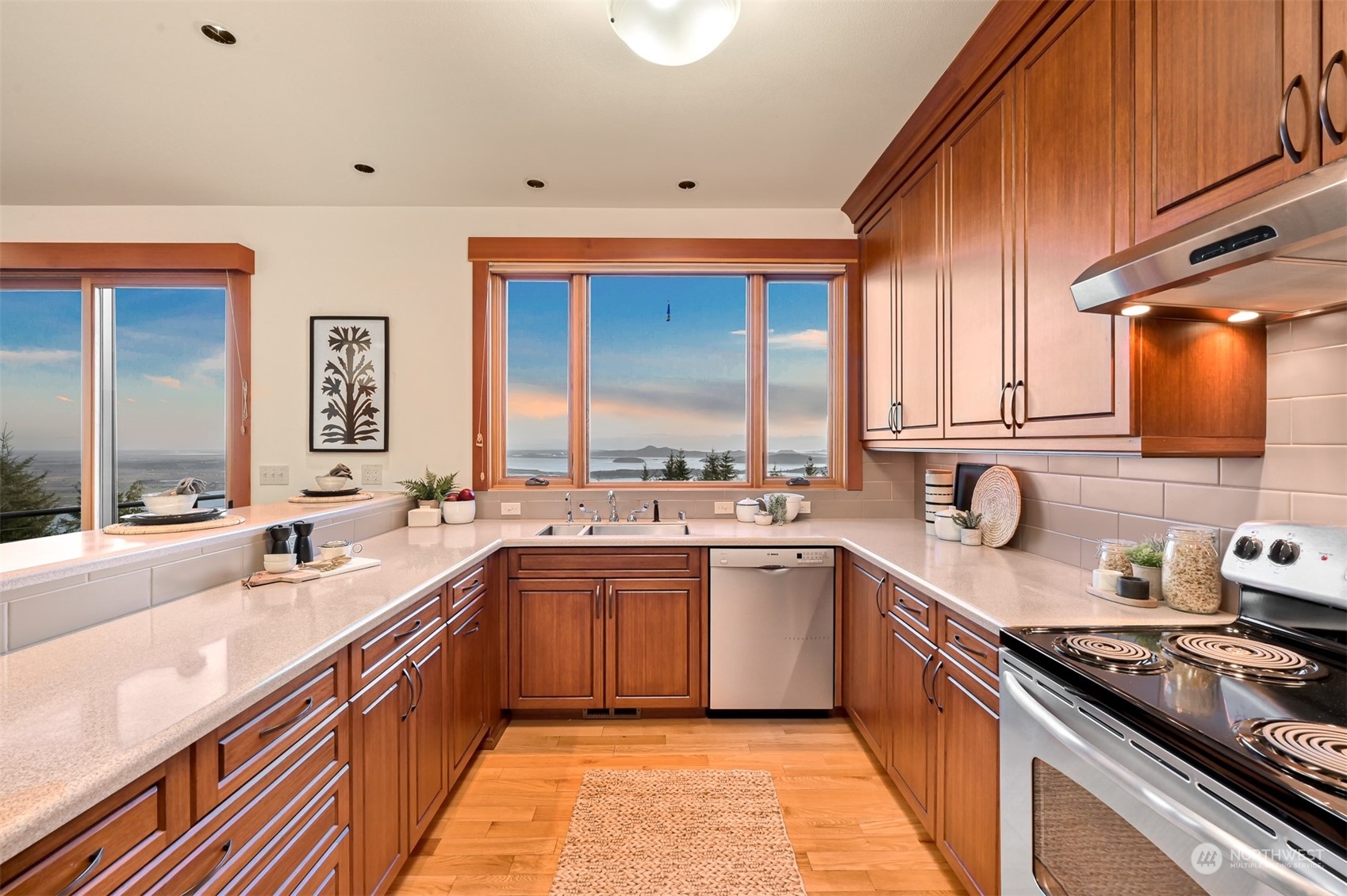 887 Chuckanut Ridge Drive Bow, WA 98232 - Photo 11 of 35 a kitchen with a sink stove and cabinets