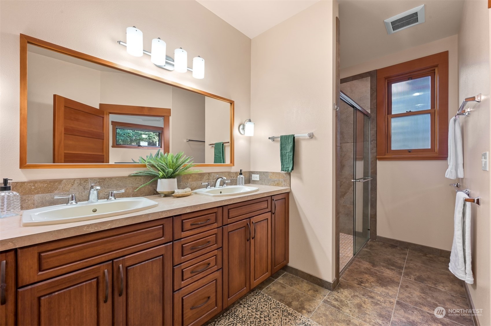 887 Chuckanut Ridge Drive Bow, WA 98232 - Photo 15 of 35 a spacious bathroom with a double vanity sink and a mirror