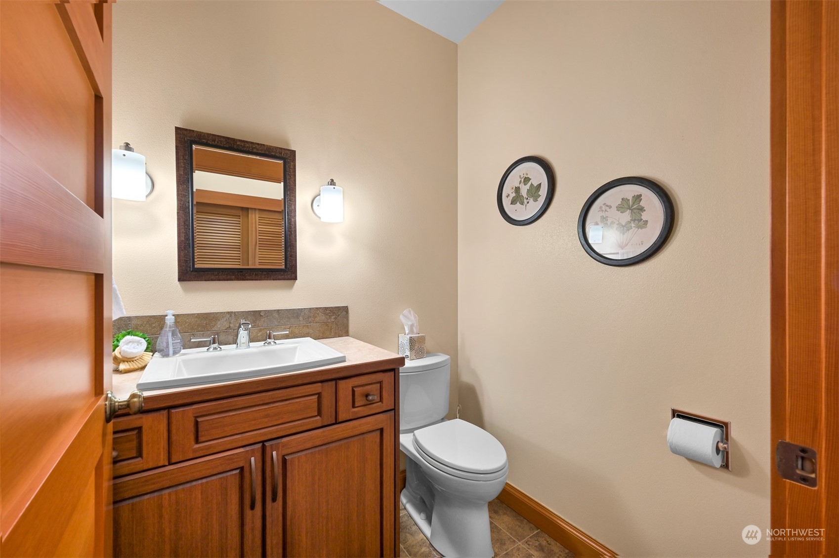 887 Chuckanut Ridge Drive Bow, WA 98232 - Photo 18 of 35 a bathroom with a granite countertop toilet sink and mirror