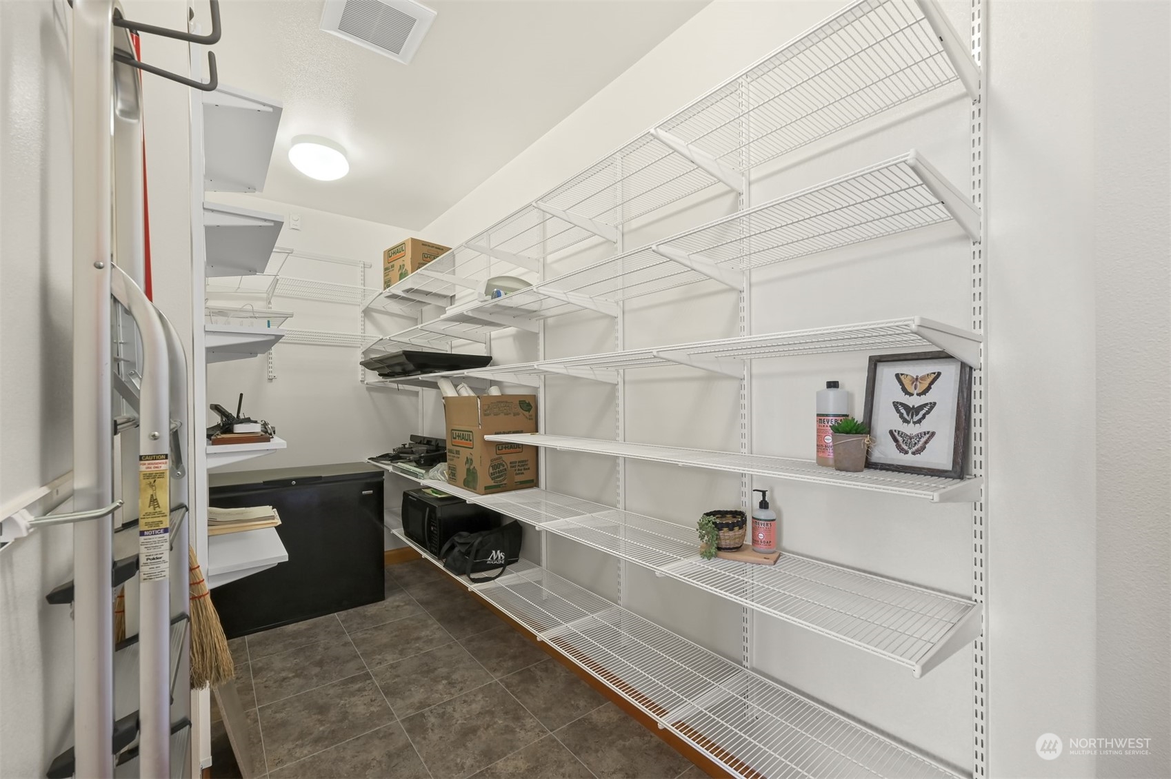 887 Chuckanut Ridge Drive Bow, WA 98232 - Photo 19 of 35 a view of a kitchen with fridge and wooden floor