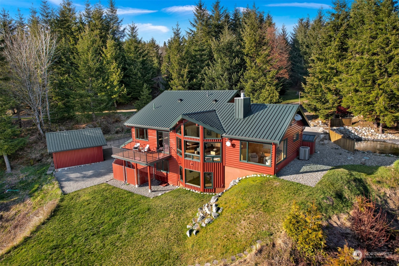 887 Chuckanut Ridge Drive Bow, WA 98232 - Photo 30 of 35 an aerial view of a house with a garden