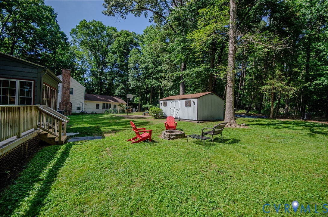 12500 Musical Lane Midlothian, VA 23113 - Photo 51 of 51 Expansive green lawn with a built-in fire pit, sur