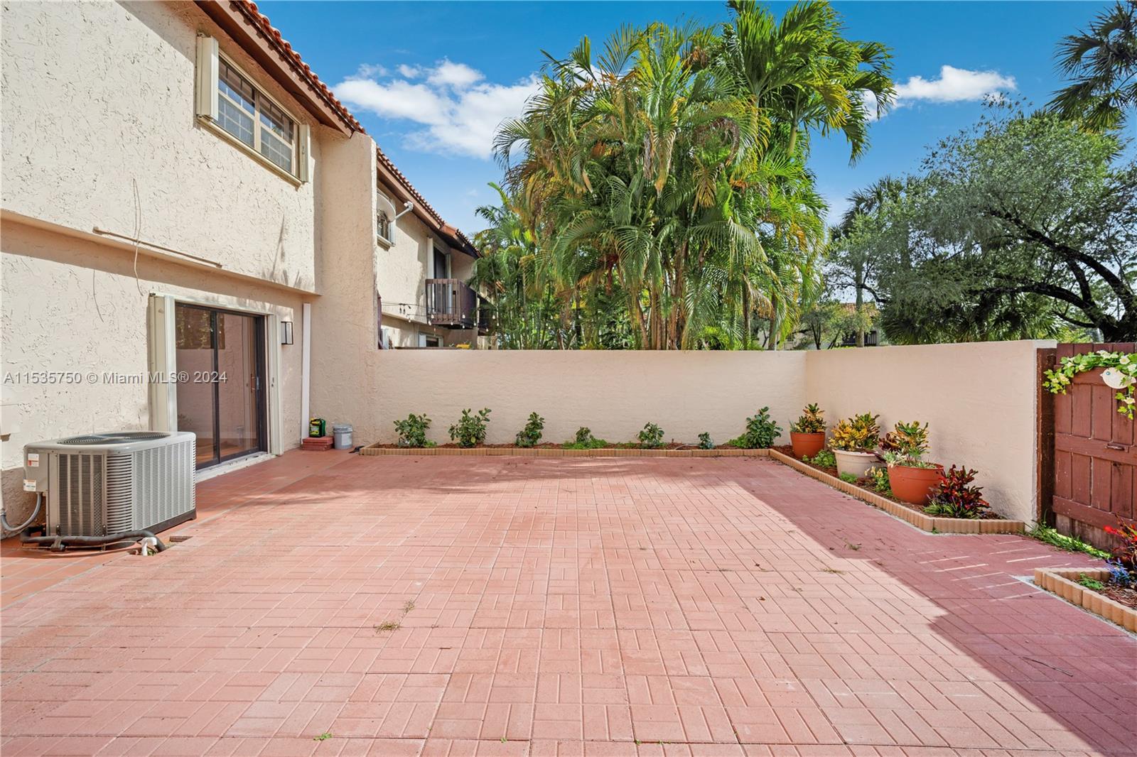 13225 Southwest 95th Avenue, Unit 13225 Miami, FL 33176 - Photo 15 of 36 a view of a backyard of the house