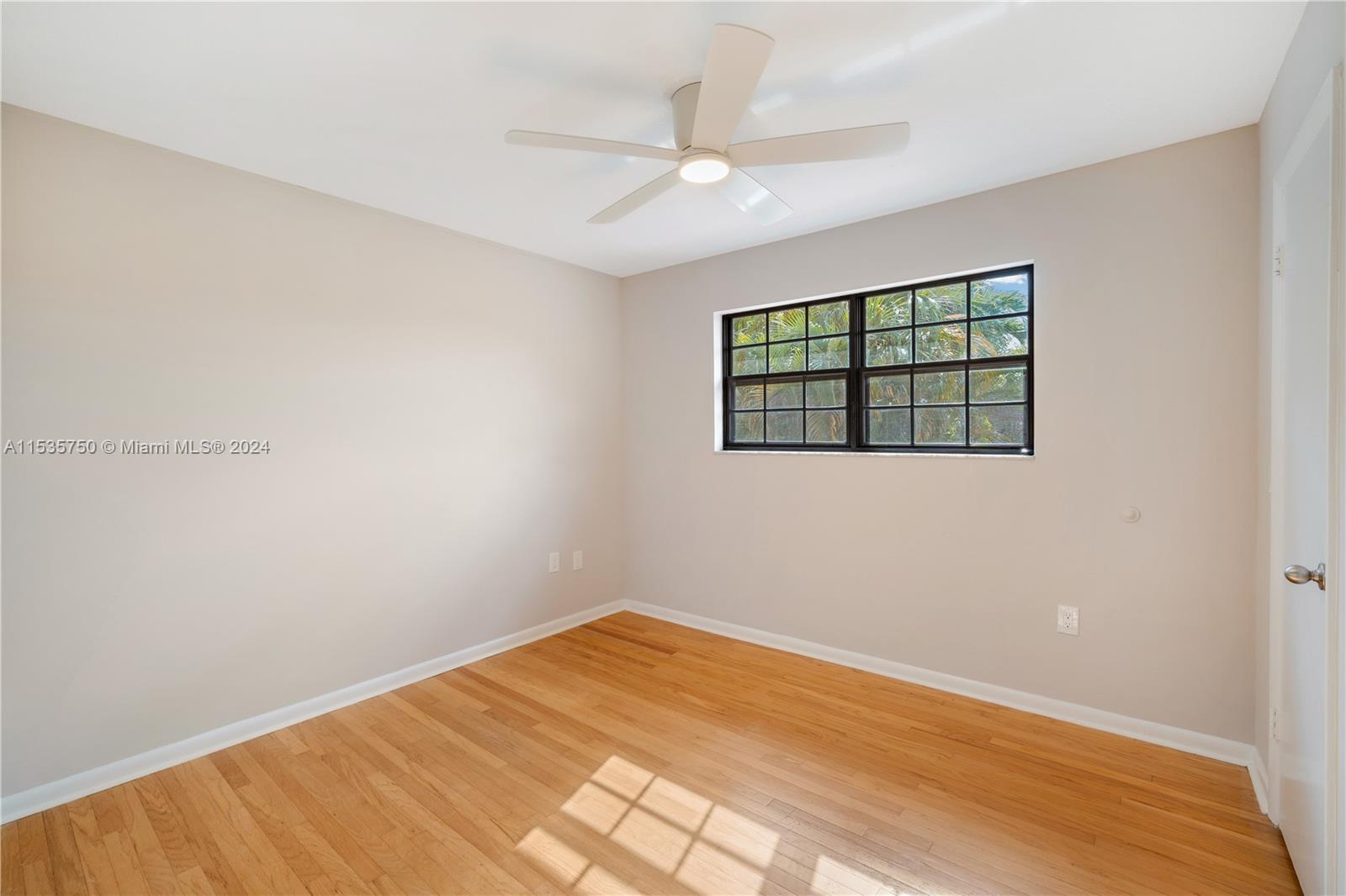 13225 Southwest 95th Avenue, Unit 13225 Miami, FL 33176 - Photo 18 of 36 an empty room with a window