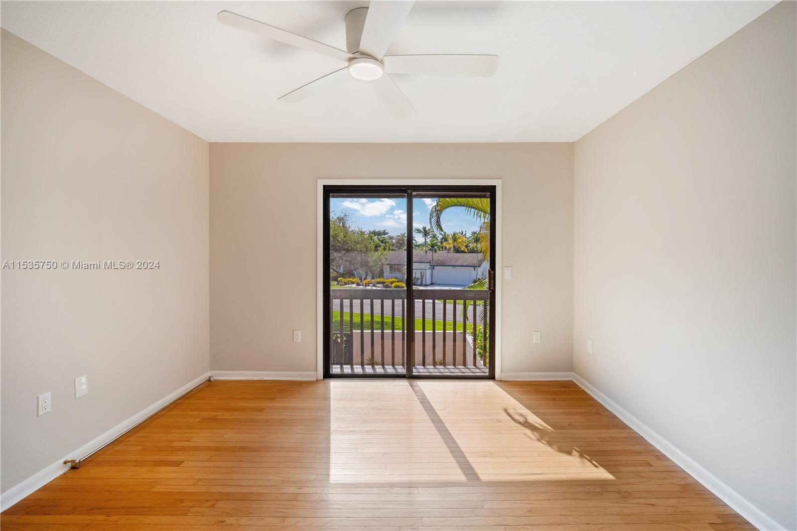 13225 Southwest 95th Avenue, Unit 13225 Miami, FL 33176 - Photo 24 of 36 a view of a room with wooden floor and windows