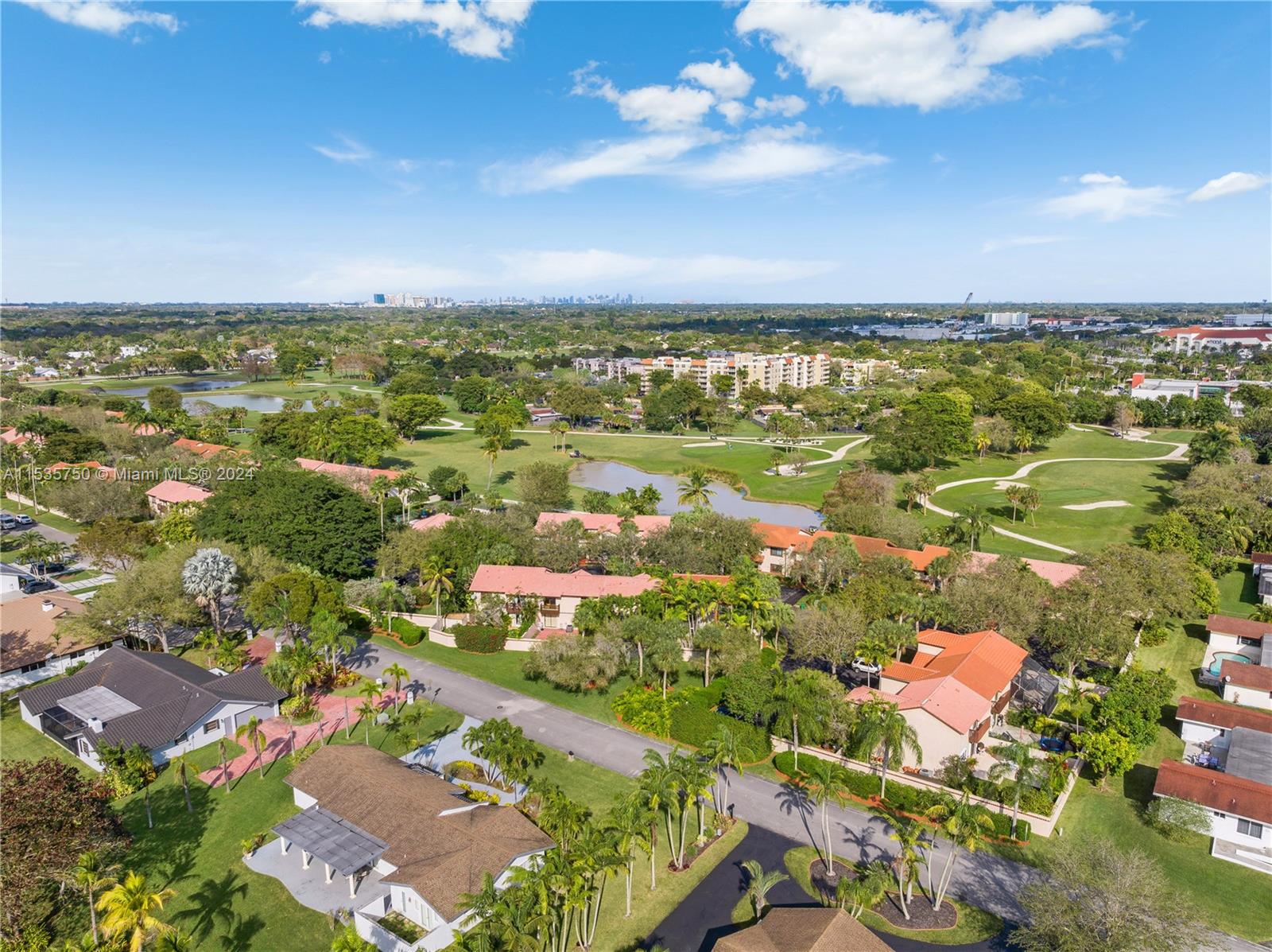 13225 Southwest 95th Avenue, Unit 13225 Miami, FL 33176 - Photo 34 of 36 an aerial view of residential building with an outdoor space and seating