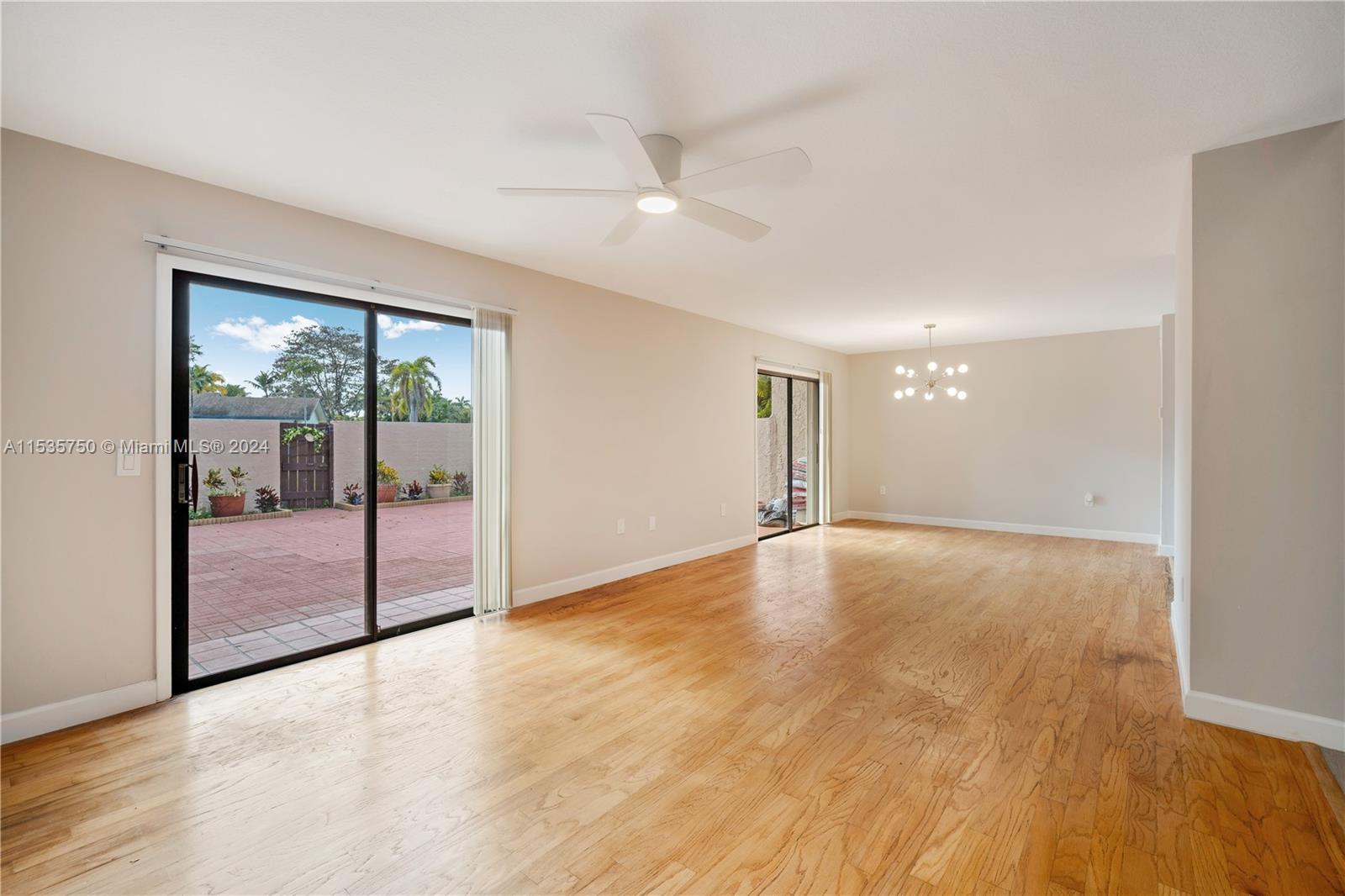 13225 Southwest 95th Avenue, Unit 13225 Miami, FL 33176 - Photo 9 of 36 a view of empty room with wooden floor