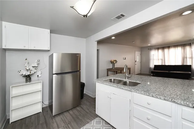 a kitchen with a refrigerator and countertop