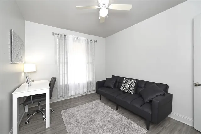 a living room with furniture and a window