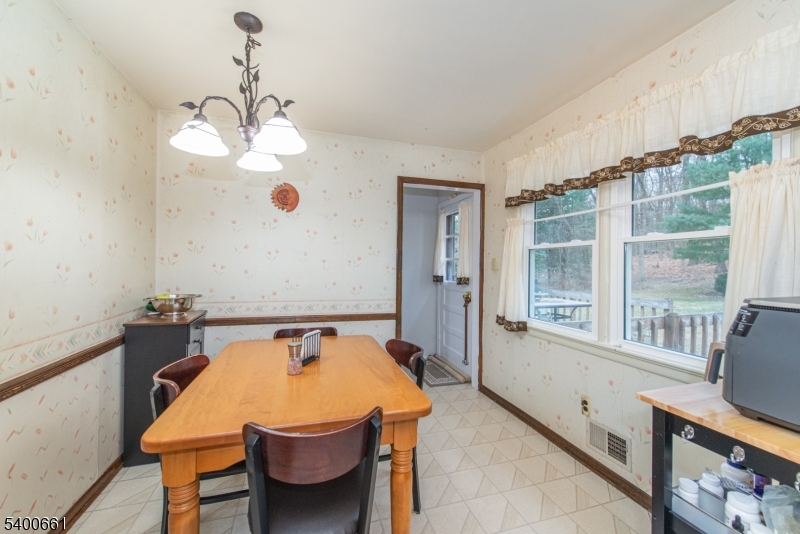131 Taylortown Road Montville, NJ 07005 - Photo 11 of 26 a dining room with a table and chairs