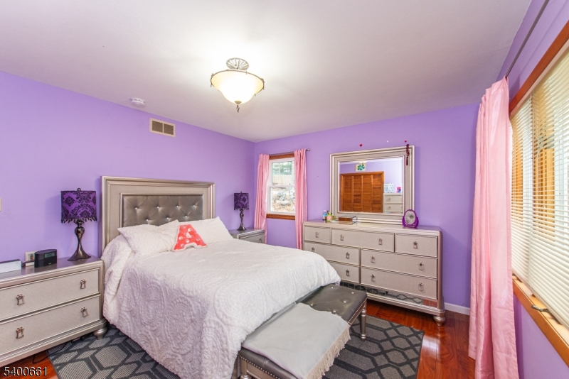 131 Taylortown Road Montville, NJ 07005 - Photo 14 of 26 a bedroom with a bed and a dresser
