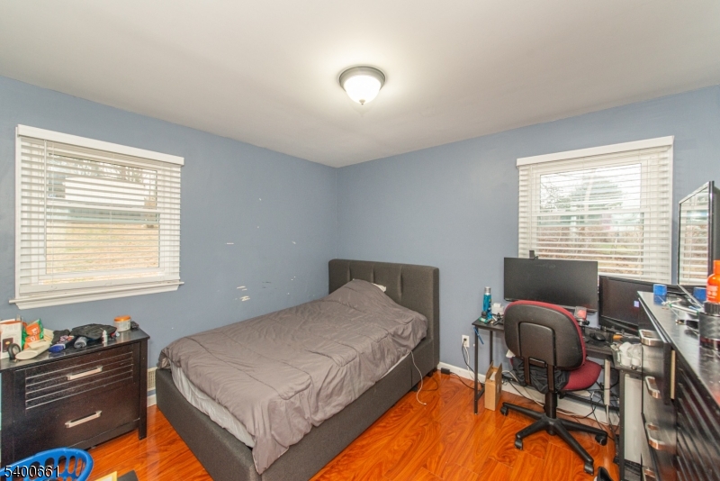 131 Taylortown Road Montville, NJ 07005 - Photo 15 of 26 a bedroom with a bed and chair