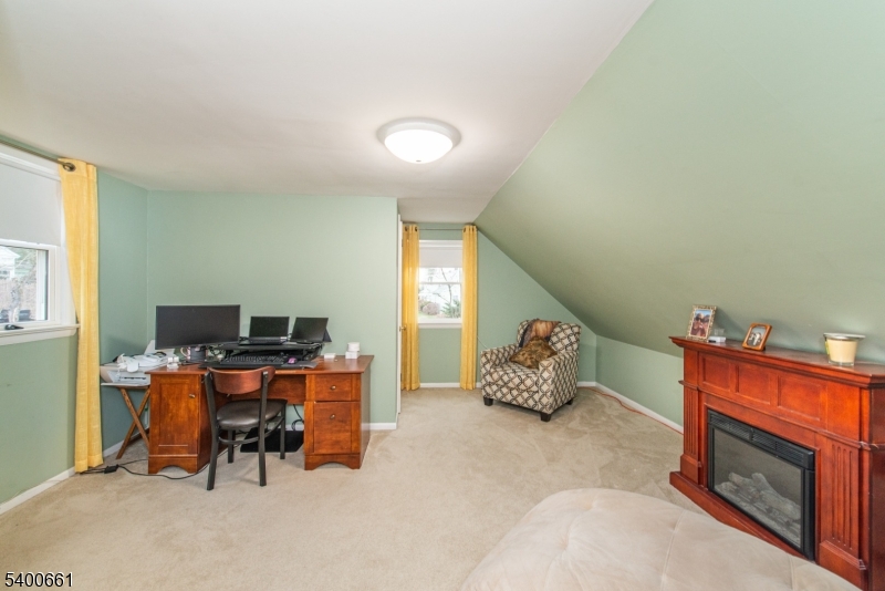 131 Taylortown Road Montville, NJ 07005 - Photo 20 of 26 a bedroom with furniture and a fireplace