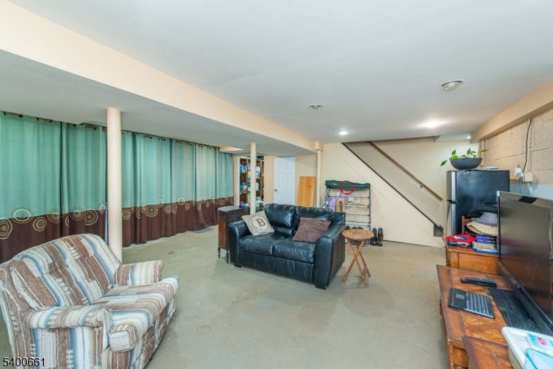 131 Taylortown Road Montville, NJ 07005 - Photo 21 of 26 a living room with furniture and a wooden floor