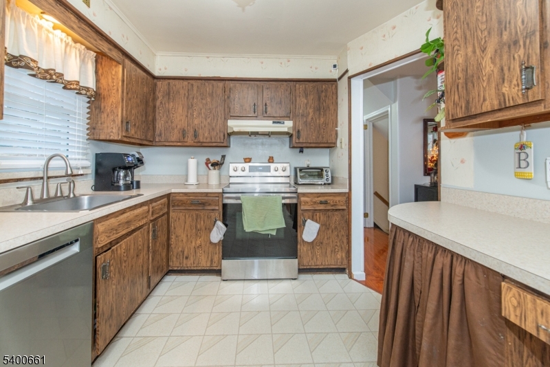 131 Taylortown Road Montville, NJ 07005 - Photo 7 of 26 a kitchen with stainless steel appliances granite countertop a sink stove and refrigerator