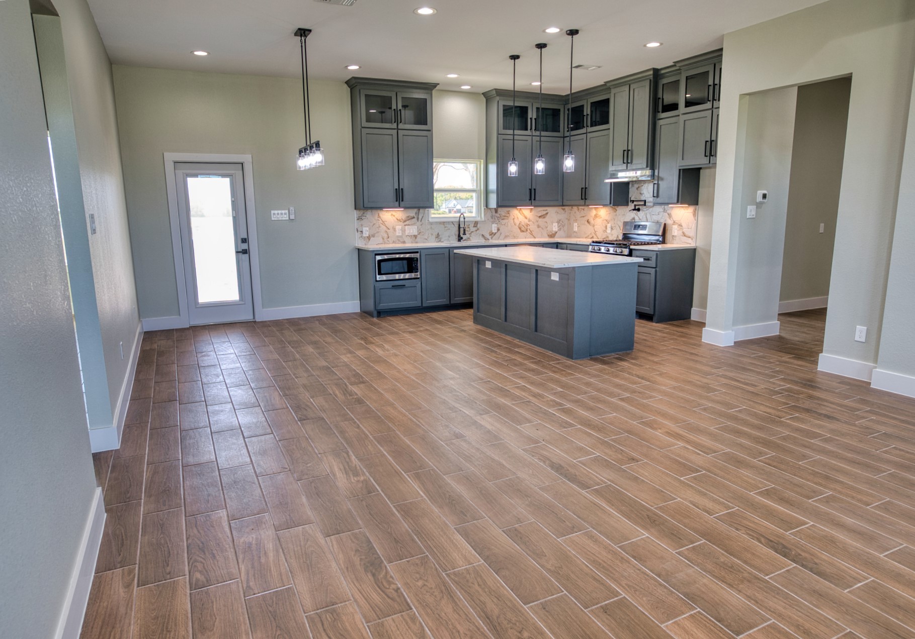 925 Buffalo Trail Angleton, TX 77515 - Photo 12 of 45 a kitchen with stainless steel appliances granite countertop a refrigerator and a sink
