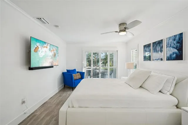 a spacious bedroom with a large bed and a window