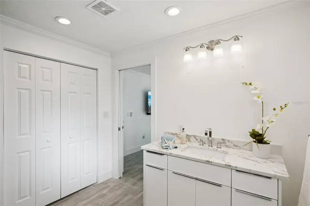 a bathroom with a toilet a sink and a mirror
