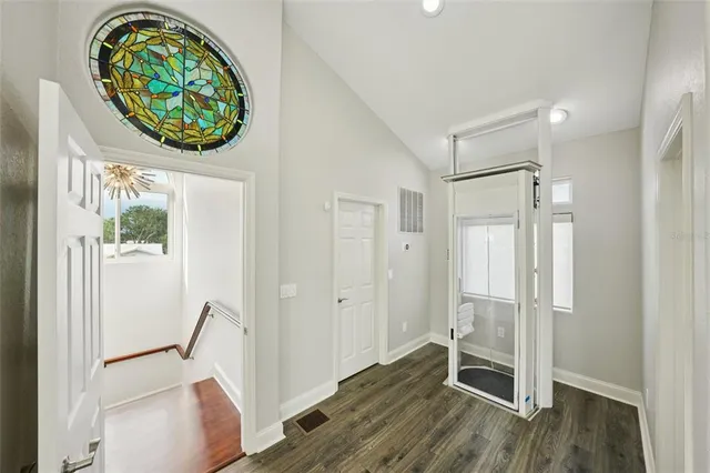 a bedroom with a bed and glass window