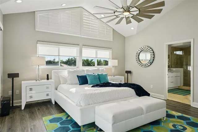 a bathroom with a granite countertop sink a mirror and shower