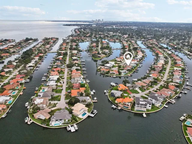 an aerial view of a residential houses with outdoor space