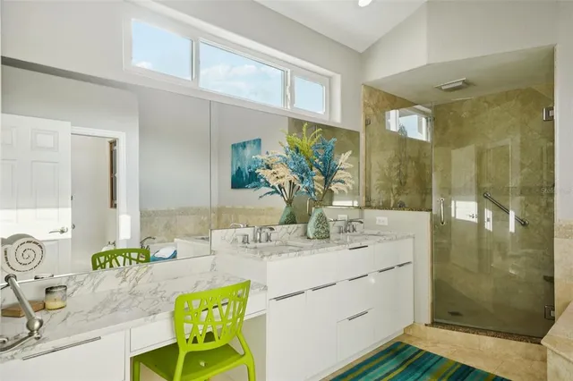 a bathroom with a tub sink and mirror