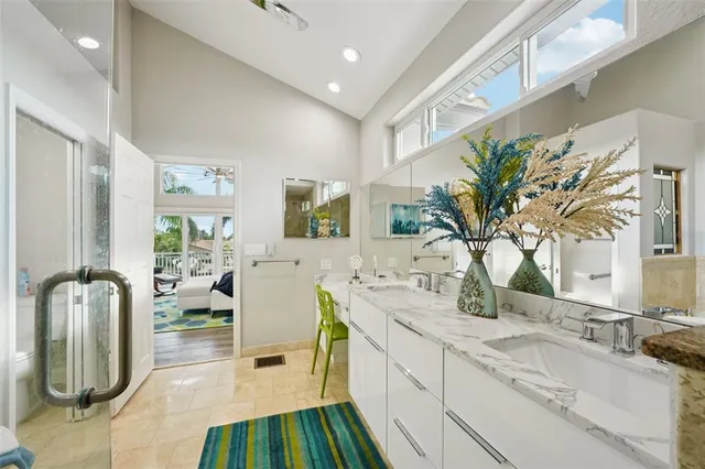 a view of a house with swimming pool and sitting area