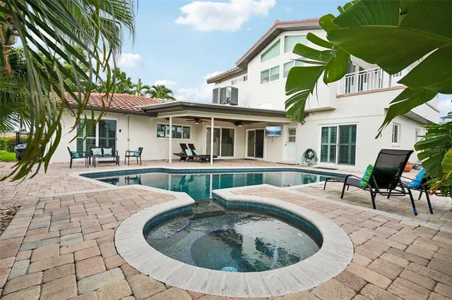 a view of a backyard with plants and a potted plant