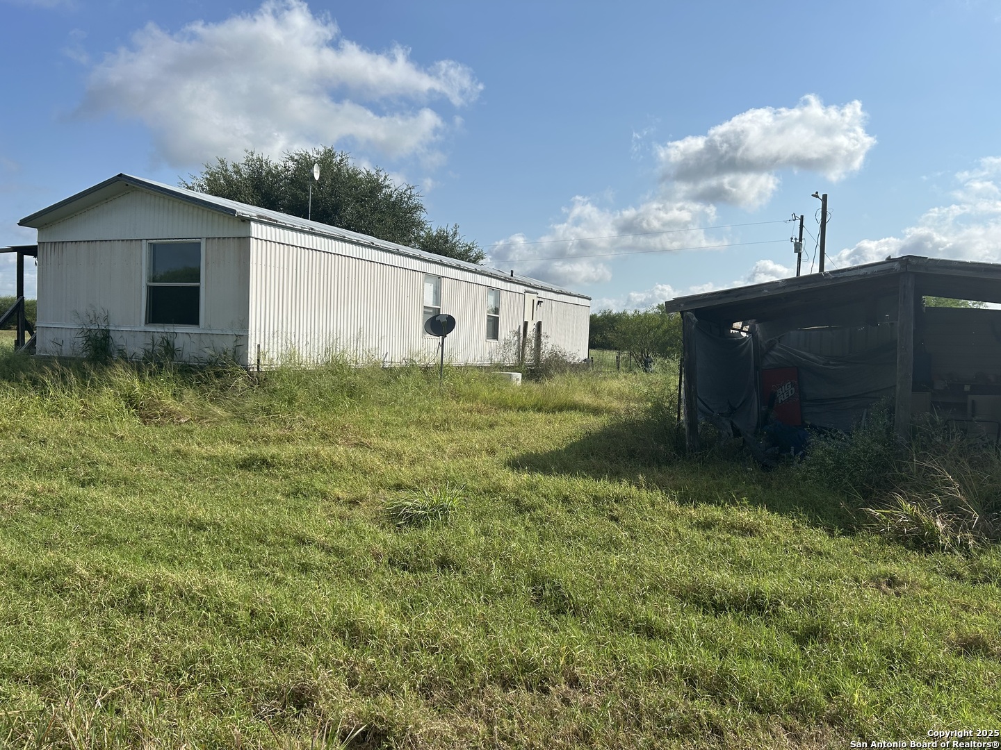 1242 Cologne Road Victoria, TX 77905 - Photo 14 of 29 a backyard of a house with table and chairs